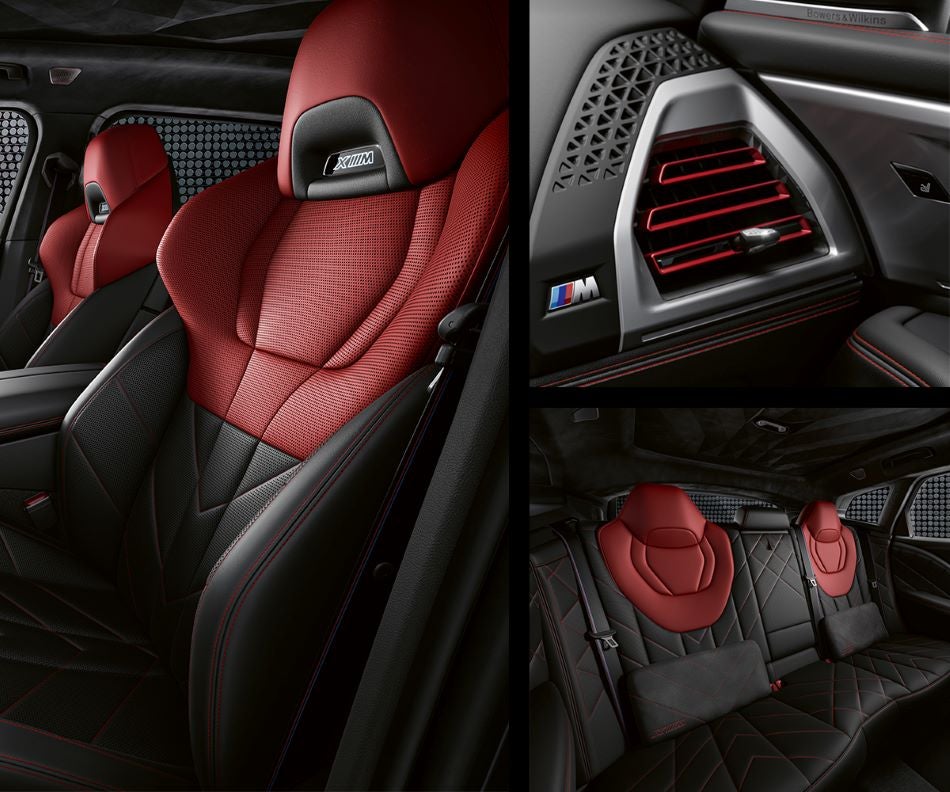 Detail of front seats, clad in exclusive BMW Individual Fiona Red & Black Merino Leather with exclusive M Signature Trim and red stitching and accents. Detail of red accented vent. Detail of rear M Lounge with exclusive XM pillows in Open Road BMW of Edison | Edison NJ