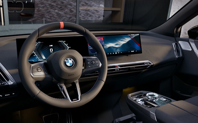 Interior steering wheel and dashboard of the BMW iX M70. | Open Road BMW of Edison in Edison NJ